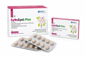 Two Gynocyst Plus Tablet boxes with blister strip, women's hormonal supplement